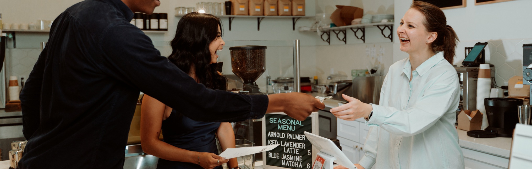 A couple paying a bill to the cashier
